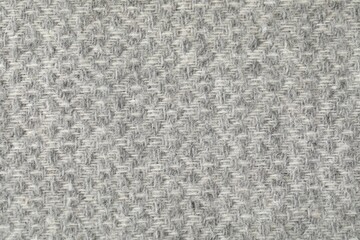 Texture of light grey wool fabric as background, top view