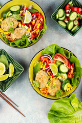 Buddha bowl with fish cakes, healthy food.