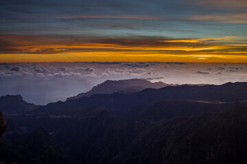 Stunning sunset view from Pico do Arieiro in Madeira with clouds and mountains in the background