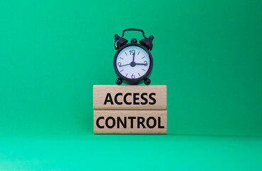 Access Control symbol. Concept words Access Control on wooden blocks. Beautiful green background...
