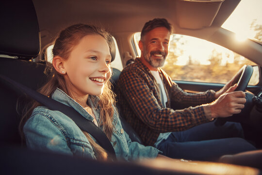 father with daughter  driving a car