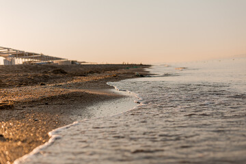 close-up of sand, shells and the sea
