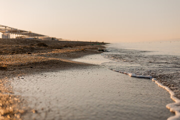 close-up of sand, shells and the sea
