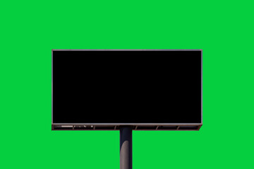 A vertical green screen advertisement display in a subway station, placed between a white and black poster, perfect for transit advertising mockups.