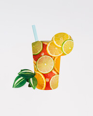 Creative paper cutout of a tropical cocktail glass, placed above a colorful citrus fruits. Minimal summer concept, symbolizing refreshing drinks, vacation vibes and fruity cocktails. Party flat lay.