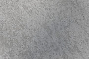 Rough gray concrete surface with natural stains and texture, ideal for backgrounds, construction themes, or architectural mockups.