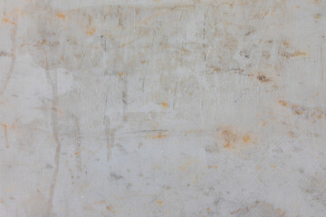 Close-up of a worn white surface with scratches, stains, and weathered textures, ideal for backgrounds, grunge design, or industrial themes.