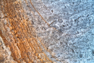 Colorful stone surface with organic lines.