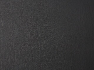 Black leather texture with fine grain and semi-matte finish