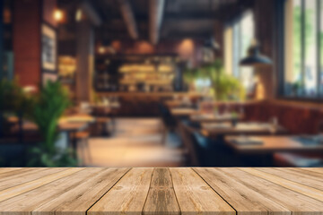 Empty wooden table in front of abstract blurred background of coffee shop . can be used for display or montage your products.Mock up for display of product