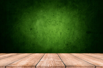 Wood table on dark green texture wall background. Composition with window shadow on bottle green wall. Mock up for presentation, branding products, cosmetics food or jewelry.