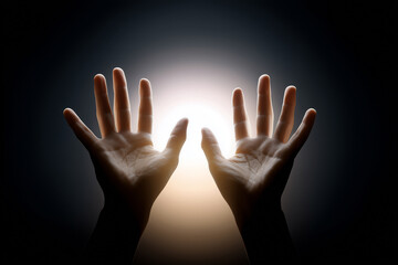 Hands Reaching Towards a Bright Light Source, Symbolizing Hope and Connection in a Dark Environment