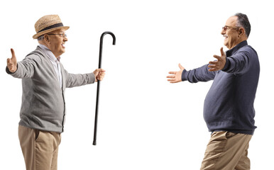 Mature man walking towards an elderly gentleman with arms wide open