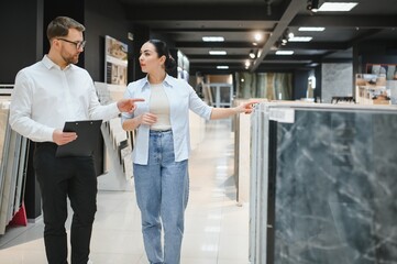 Exploring tile options in a modern showroom