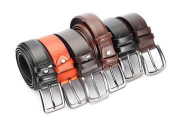 Many different leather belts isolated on white