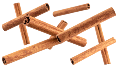 Cinnamon sticks rotating in mid air, isolated on transparent background