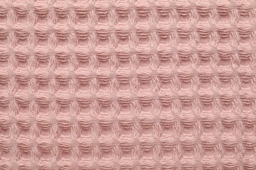 Naklejka premium Clean pink waffle towel as background, top view
