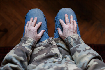 veteran soldier with depression sitting in chair