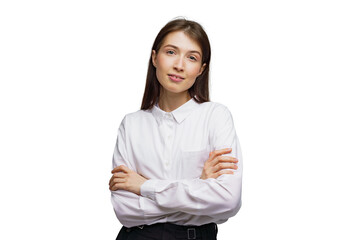 Confident young woman poses with crossed arms, exuding calm elegance in a minimalist setting