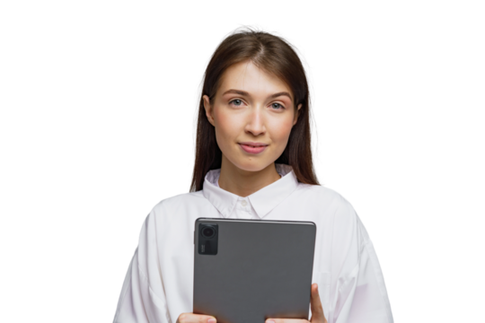 Smiling woman holds a tablet while standing against a plain white backdrop in a modern setting