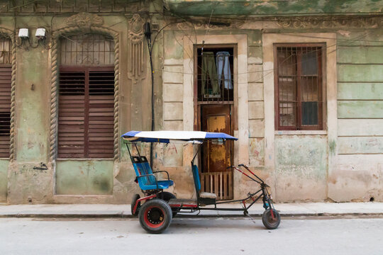 Cuba, Cienfuegos. Tuk Tuk, small wheeled cart transportation.