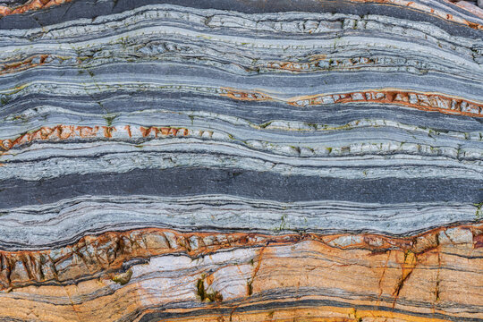 Spain, Barrika. Contorted rock layers on beach.