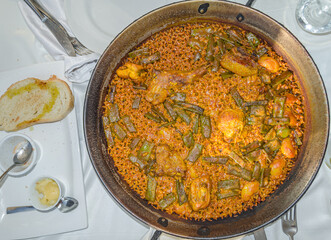 Valencian paella, a typical dish from Valencia, is one of the best-known dishes in Spanish cuisine