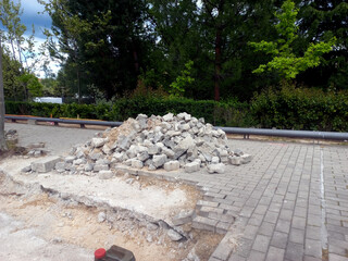 Urban infrastructure and construction concept: sidewalk repair scene