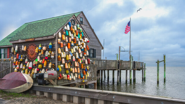 USA, New Jersey. Fishing floats and sun disc as wall decorations.