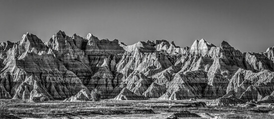 The wind and water eroded landscape in the Badlands National Park seem desolate but make for beautiful natural carvings. USA