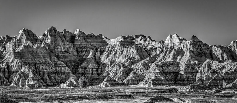 The wind and water eroded landscape in the Badlands National Park seem desolate but make for beautiful natural carvings. USA