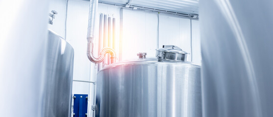 Banner Modern beer factory with stainless steel brewing equipment and pipes
