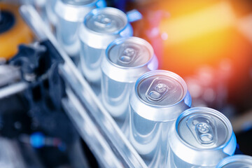 Top view Modern beer canning line in brewery with shiny aluminum cans and equipment