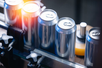Fototapeta premium Beer production line in brewery factory with aluminum cans, sunlight