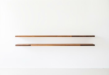 Fototapeta premium A pair of wooden shelves on a white wall.