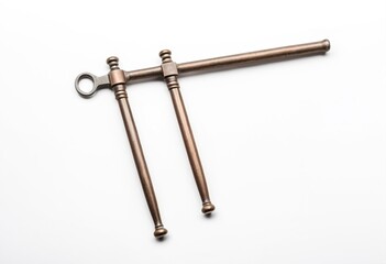 A metal hook on a white surface.