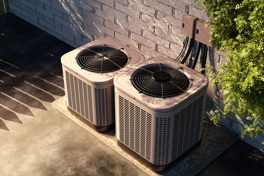 Top view of two outdoor air conditioning units connected to a brick wall, used for residential temperature control. HVAC. Installation. Home maintenance.