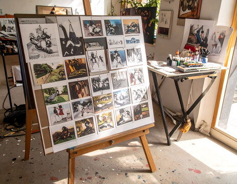 Artists studio featuring an easel displaying a collection of storyboards, capturing the creative process. Bright, inspiring, suitable for arts, education, and creative industries.