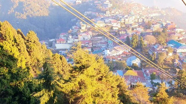 Mussoorie forest Uttarakhand winter lineis visible on the western horizon in the evening from midOctober to January. Sun sets, shades of yellow, red, orange, purple.