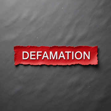 Red color inserted label with word defamation on gray background