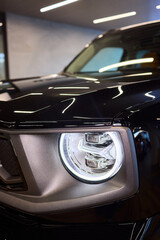 Close up of a cars headlight, part of automotive design