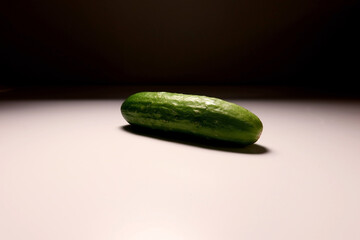 Whole Fresh Green Cucumber on White Background with Studio Lighting – Minimalist Food Photography for Healthy Eating and Vegetarian Concept