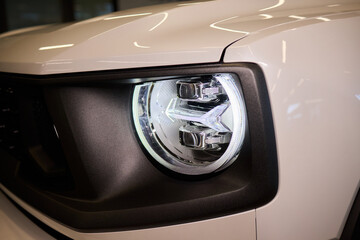Close up of a cars headlight, part of automotive design