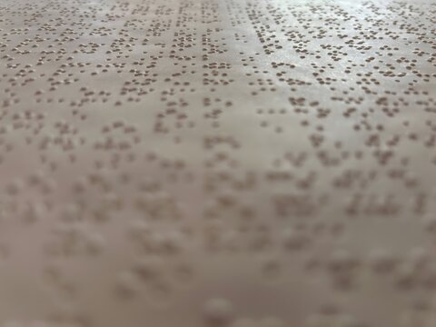 paper background with braille dots