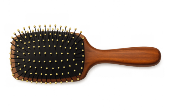 Wooden-handled hairbrush resting on clear surface, featuring black bristle pad with rounded tips