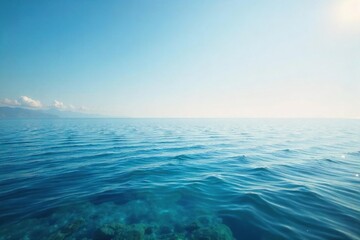 Fototapeta premium Vast, tranquil ocean meeting the endless horizon under a clear sky Perfect for travel, nature, or serenity themes The calm water reflects the light beautifully , tranquility, serene