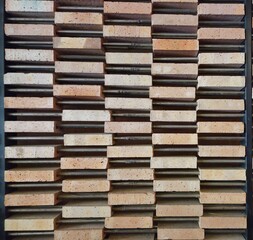 A brick wall with a pattern of squares and rectangles