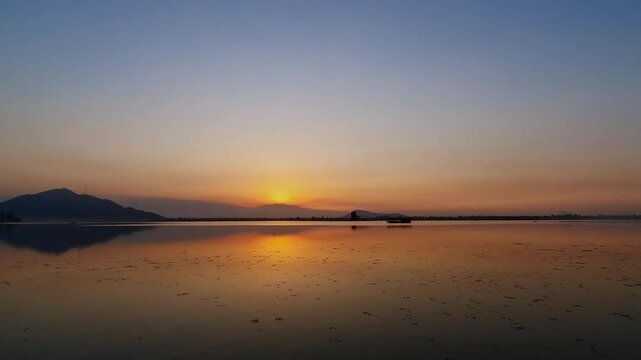 Dal Lake Evening Glow, Golden Reflections Over Fresh Waters Creating A Breathtaking Destination In Srinagar Kashmir Capturing Nature Peace And Beauty