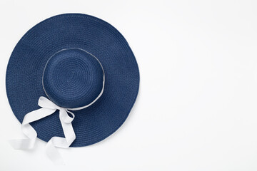 Blue beach hat on color background,top view