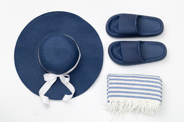 Blue beach accessories on color background, top view. Flat lay